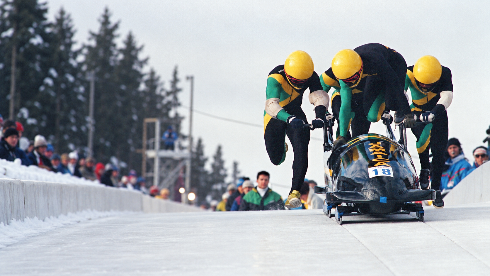 The Jamaican bobsled team pushing their sled at the 1988 Winter Olympics